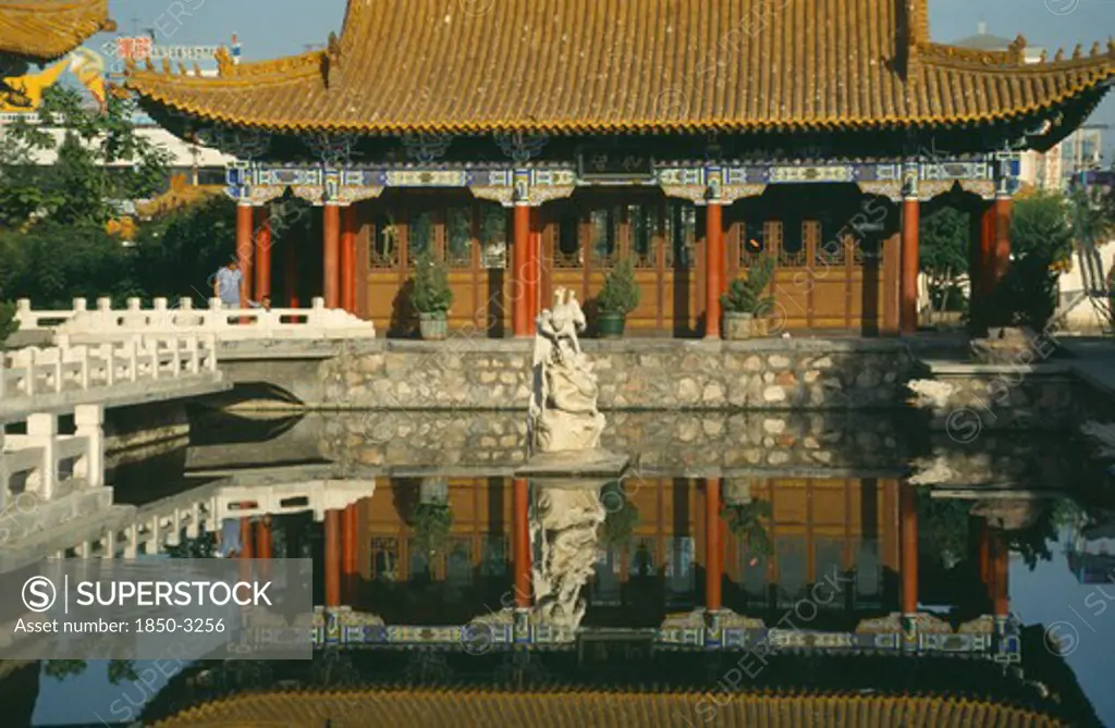 China, Ningxia, Yinchuan , Pavilion In The Park Reflected In Pool In The Foreground
