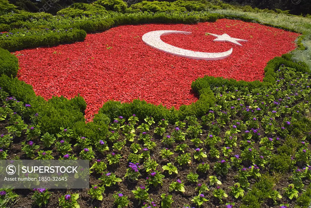 Turkey Cappadocia Ankara Anitkabir Mausoleum of Kemal Ataturk The Turkish flag as map of the country made of red and white pebblestones set amongst flowers.