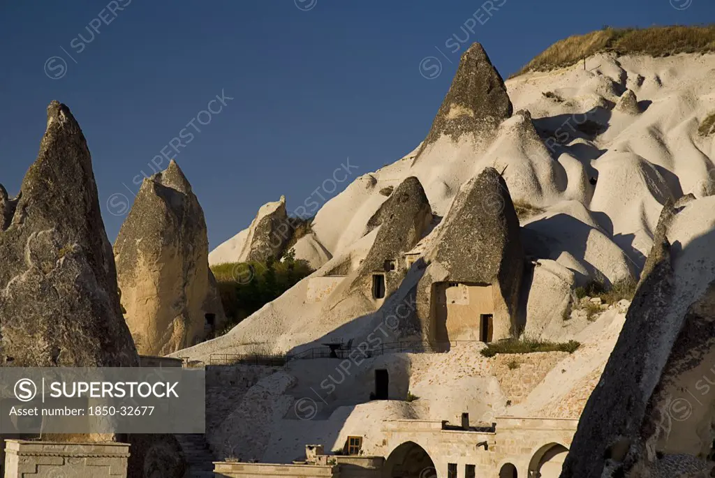 Turkey, Cappadocia, Goreme, Cave dwellings set into hillside.