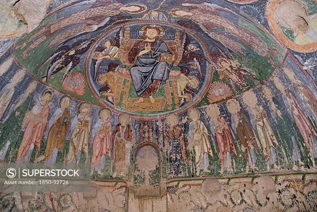 Turkey, Cappadocia, Goreme, Red Valley, Hacli Kilise is the Turkish title for the church. It means the church with the cross, Frescoes on ceiling, superstitous gouging has taken place  to eradicate the evil eye.