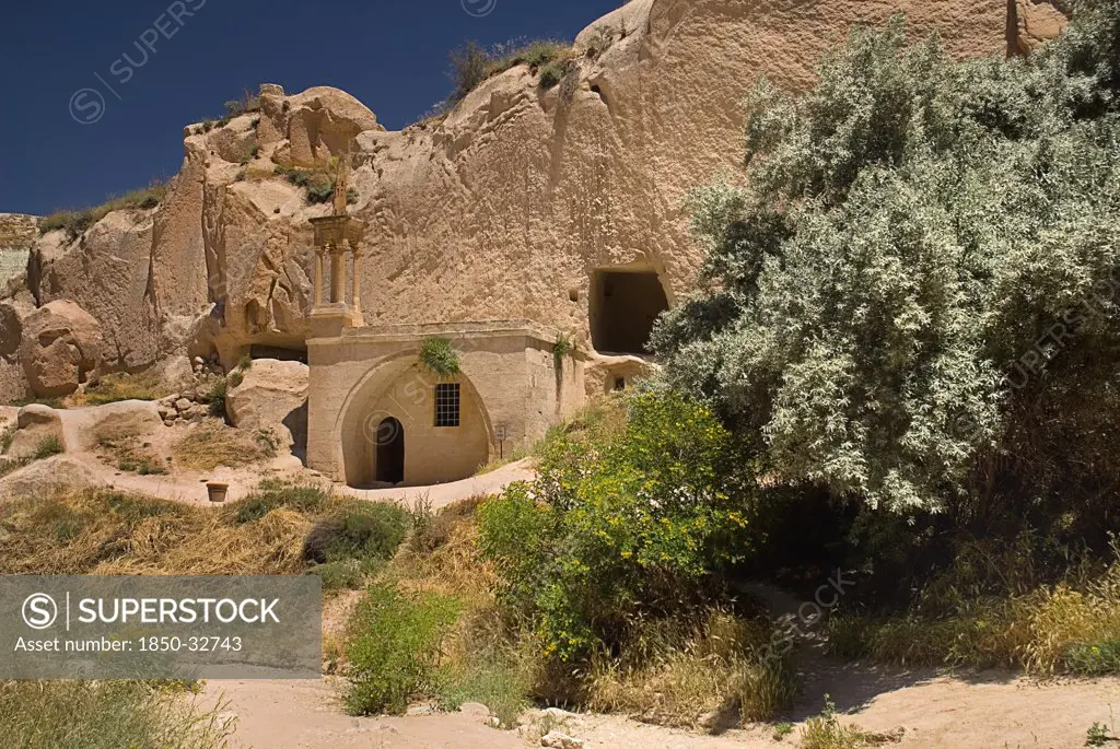 Turkey, Cappadocia, Zelve, Zelve Open Air Museum, Abandoned houses, Zelve is where 3 valleys of abandoned homes and churches converge, inhabited until 1952 when the valley was deemed too dangerous to live in any more. Small unadorned rock cut mosque.