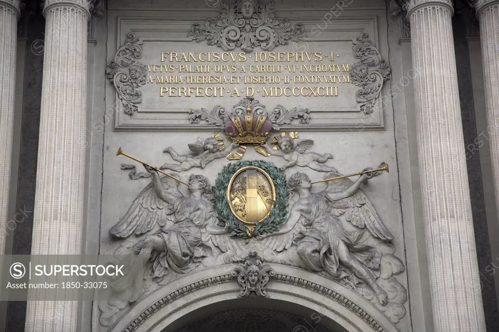 Austria, Vienna, Inscription & sculpted figures above the Michaelertrakt gateway to the Hofburg Palace
