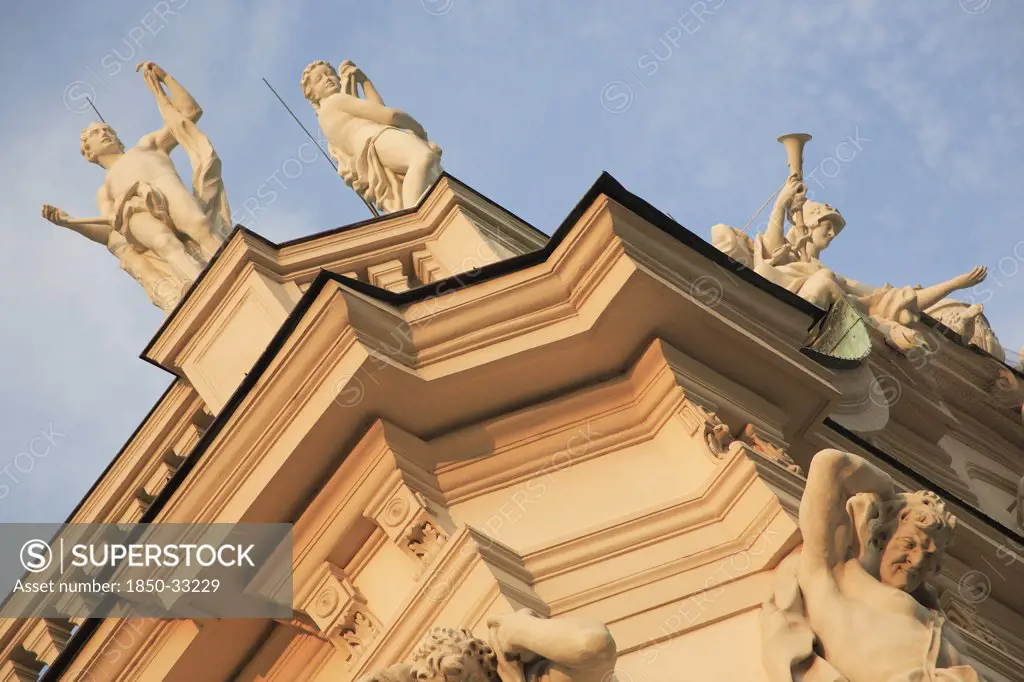 Austria, Vienna, Belvedere Palace, Detail of roof statues and carvings on the exterior facade.