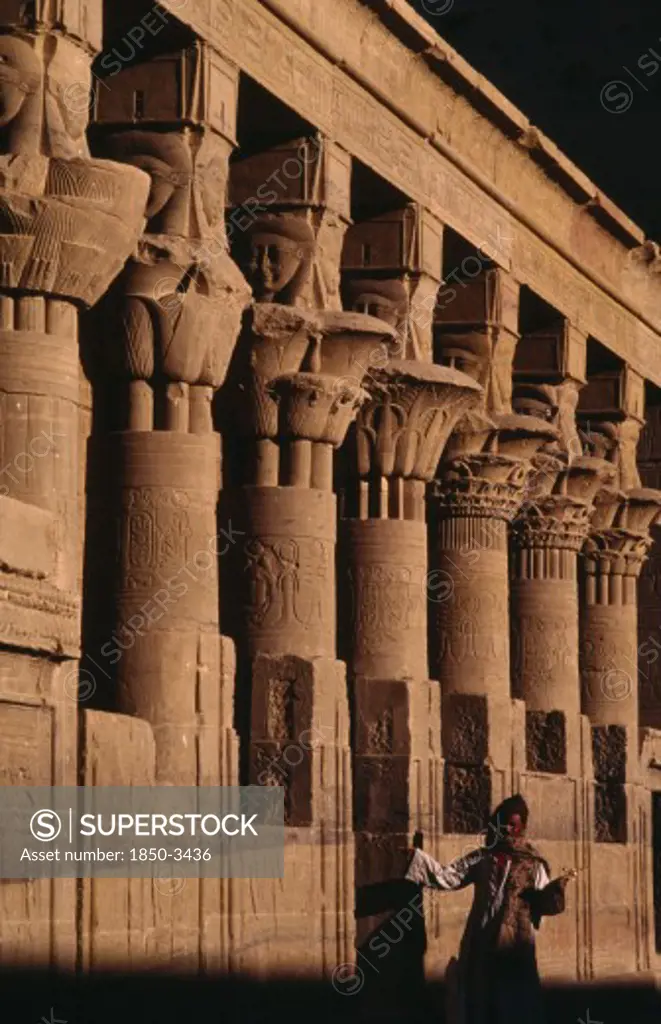 Egypt, Philae, Column Details On Temple Island Of Philae Near Aswan. Guide At Base Of Columns