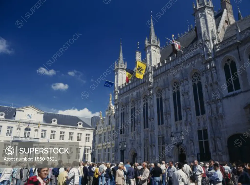 Belgium, West Flanders, Bruges, Burg Square With Tourists Outside The Stadhuis