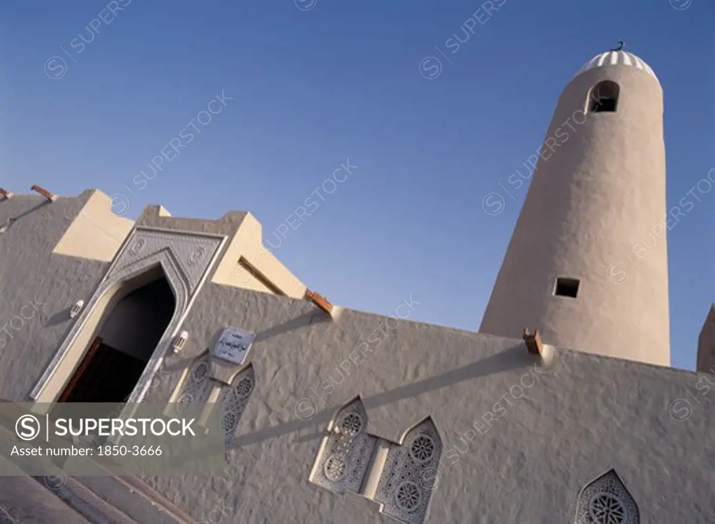 Qatar, Doha, Angled View Of Small Mosque In The Old Souk Area Showing Front Entrance And Minaret.