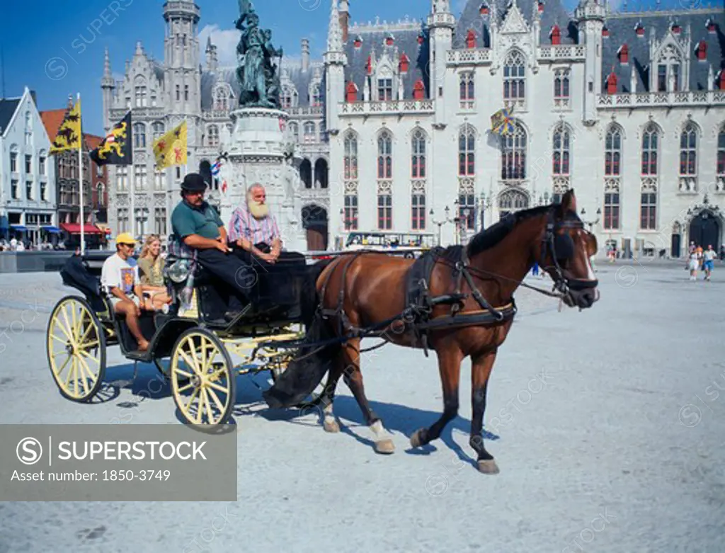 Belgium, West Flanders, Bruges, ' A Horse Drawn Tourist Carriage In The Main Square, Grote Markt.'
