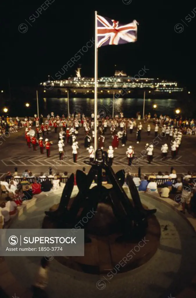 Bermuda, Music, Band Of The Bermuda Regiment Performing Beat The Retreat A Musical Call Under Spotlight Which Derives From A British Army Tradition.