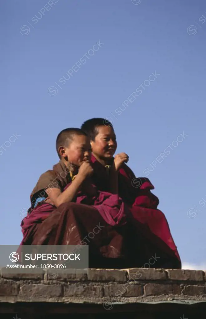 China, Qinghai , Festivals, Young Monks Watching Tibetan Festival.