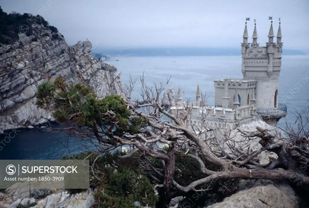Ukraine, Yalta, The Swallows Nest. Small Castle With High Tower Built On A Cliff Edge Over The Sea