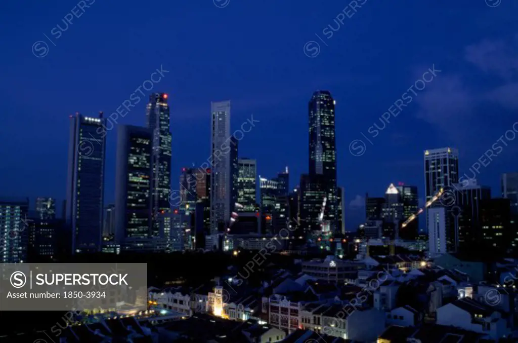Singapore, Raffles Place, City Skyline Illuminated At Night