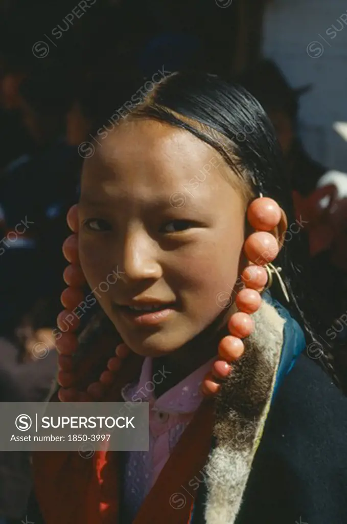 China , Qinghai, Tongren, Tibetan Girl With Coral Ornaments Around Her Head
