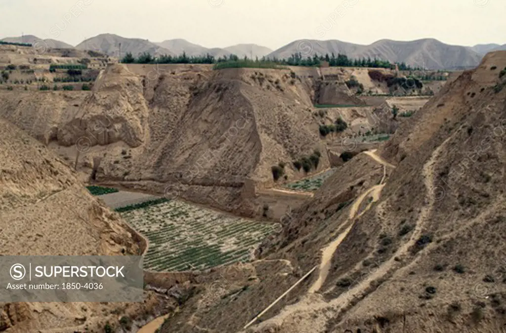 China, Gansu, Lanzhou , Loess Eroded Valleys And Terracing For Crops.