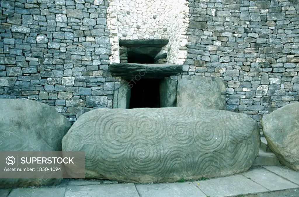 Eire, County Meath, Newgrange, Entrance To Prehistoric Burial Site In The Boyne Valley With Carved Stone In The Foreground