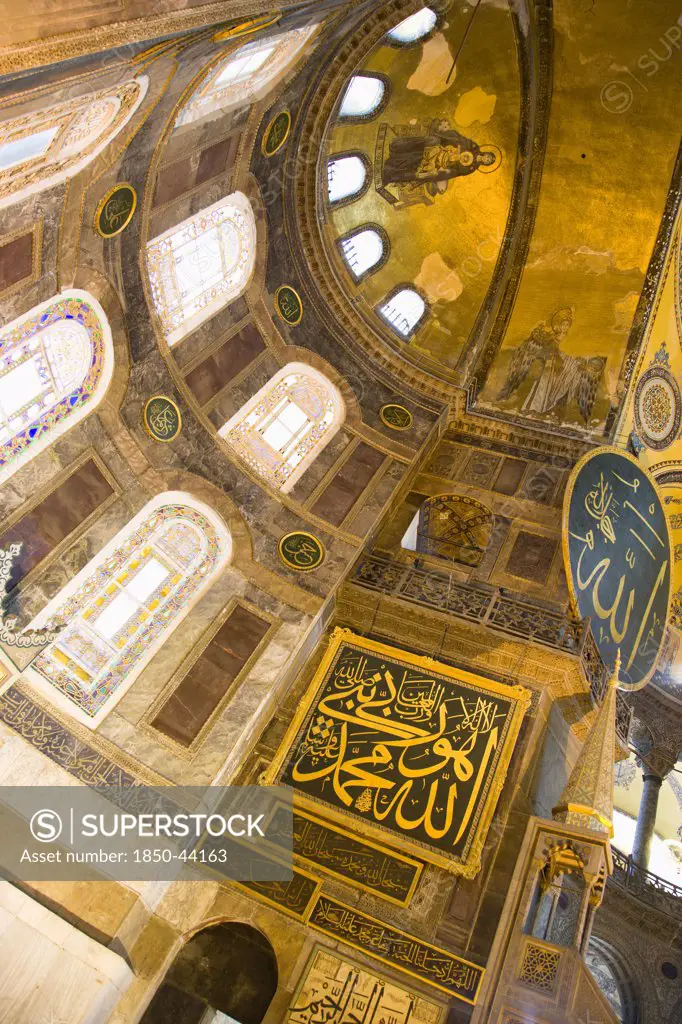 Turkey,  Istanbul, Sultanahmet Haghia Sophia Christian murals and Muslim iconography in calligraphic roundels together in the domed interior.