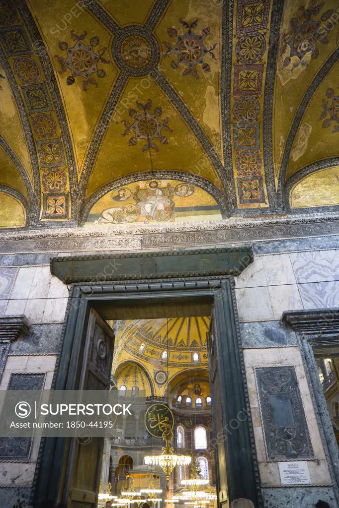 Turkey,  Istanbul, Sultanahmet Haghia Sophia The Imperial Gate with mosaics above and the Nave of the Cathedral beyond.