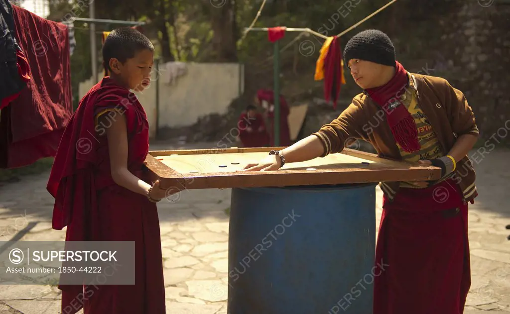 India,  Sikkim, Buddhist Monks playing carrom.