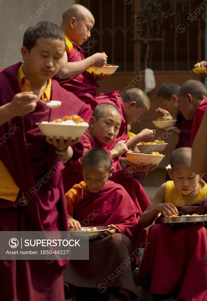 India,  Sikkim,  Buddhist Monks at lunch break.