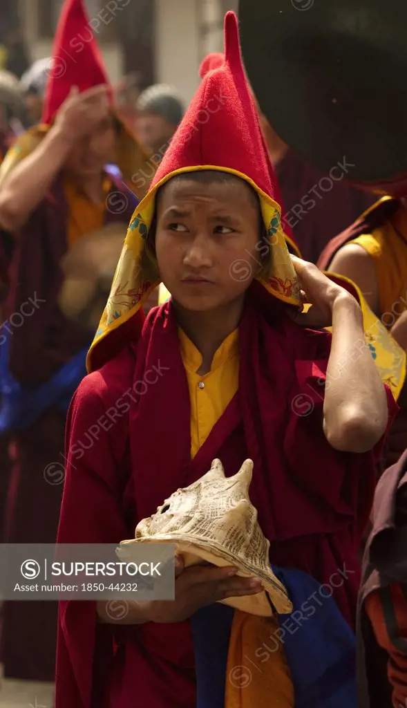 India,  Sikkim, Buddhist monk in a Losar ceremonial procession.