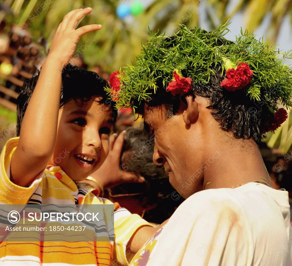 India, Goa, Siolim,  San Jao Festival celebrated with flower head wreaths.