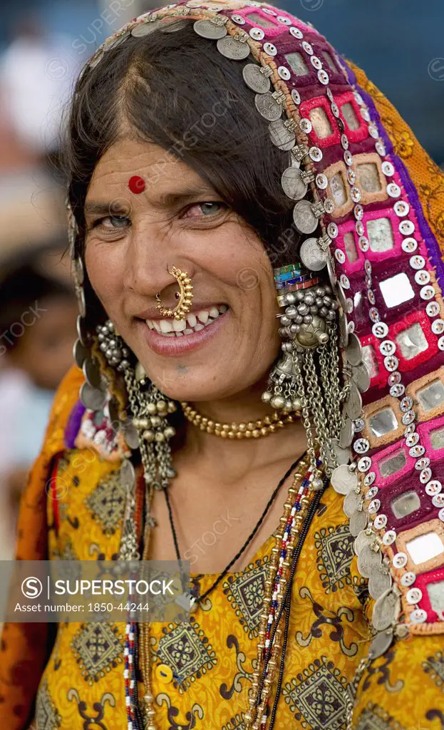 India, Karnataka, People, Smiling Lambani Gypsy woman with gold nose ring. Tribal forest dwellers now settled in 30-home rural hamlets. Related to the Rabaris gypsies of Kutch Gujarat.