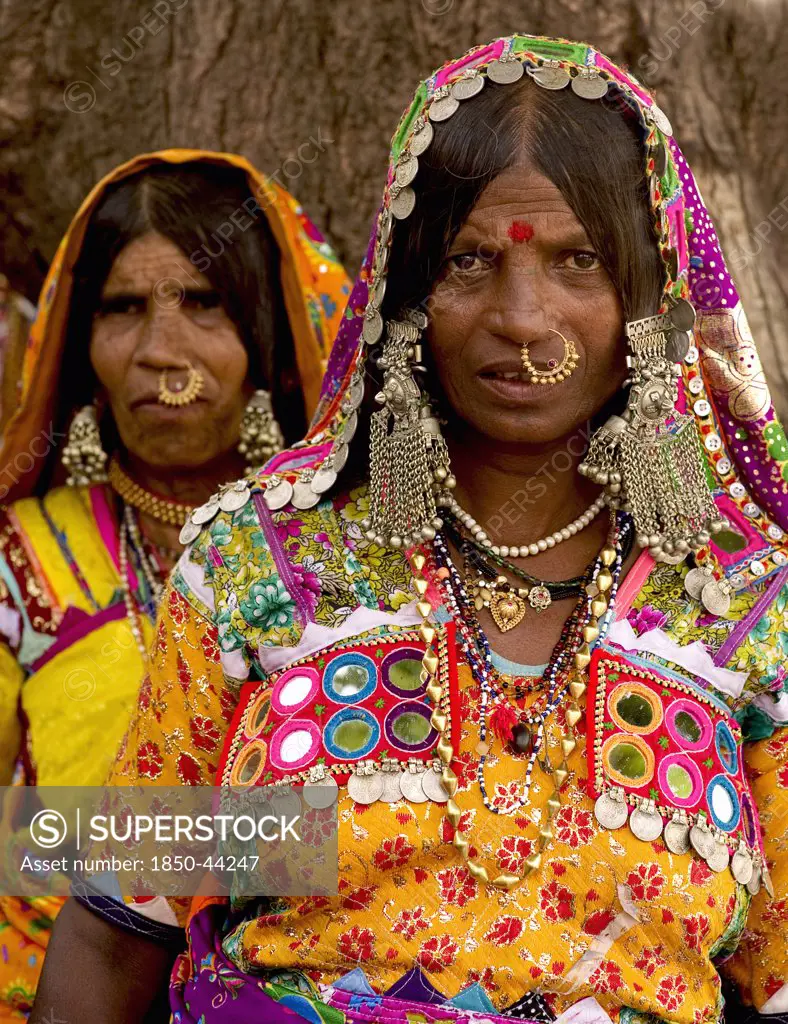 India, Karnataka, People, Lambani Gypsy women wearing gold nose rings. Tribal forest dwellers now settled in 30-home rural hamlets. Related to the Rabaris gypsies of Kutch Gujarat.