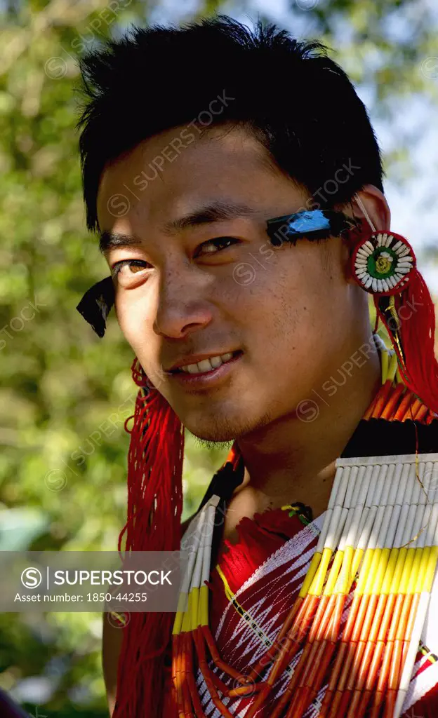 India, Nagaland, People,  Naga Warrior in traditional costume and jewelry.