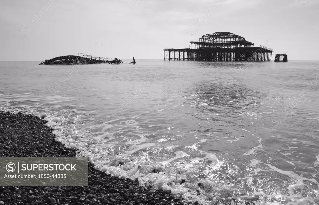 England, East Sussex, Brighton, Ruins of the burnt out West Pier fallen into the sea.