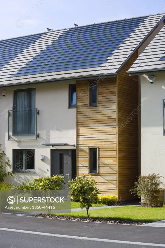 Architecture, Environment, Solar Power, Alternative Energy Electricity Solar photovoltaic roof tiles or slates on new houses by Linden Homes in Graylingwell Park.