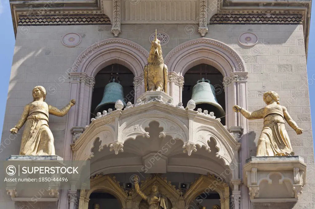 Italy, Sicily, Messina, Piazza Del Duomo Cathedral bell tower with golden statues.