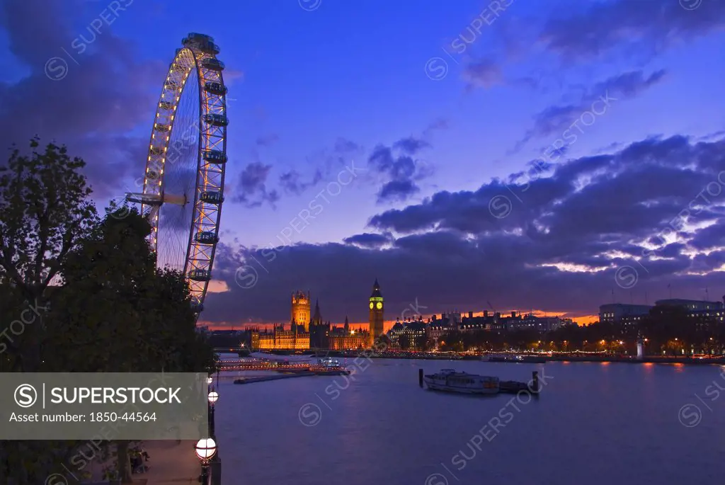 England, London, London, Houses of Parliament and London Eye at dusk.