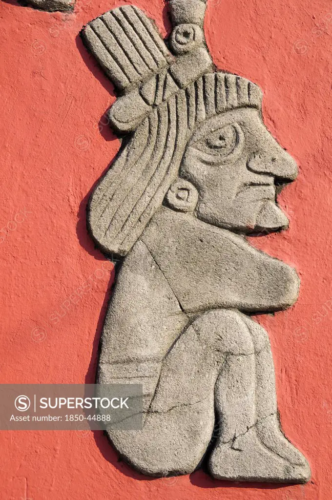 Detail of relief carving of Totonac figures on the Mural Cultural Totonaca in the Zocalo.Mexico Veracruz Papantla
