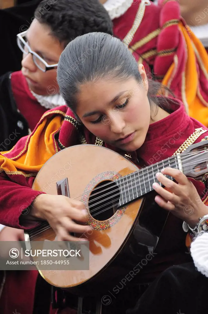 Musician playing stringed instrument in the Jardin de la Union.Mexico Bajio Guanajuato