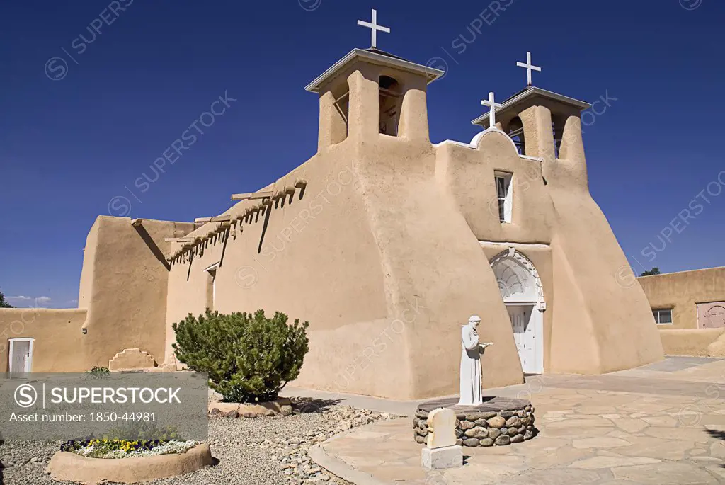 Church of San Francisco de Asis. Angled view of church exterior with adobe style architecture.USA New Mexico Taos