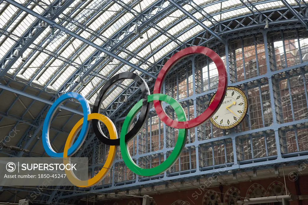 St Pancras railway station on Euston Road Olympic Games sign and clock in the terminal.England London