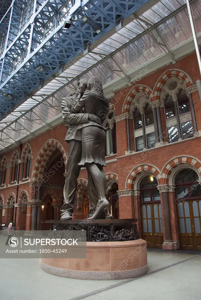 St Pancras railway station on Euston Road The Meeting Place statue by Paul Day.England London