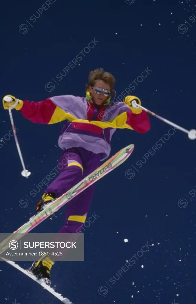 Usa, Colorado , Vail, Lone Acrobatic Skier In Mid Air Pose Against Deep Blue Sky