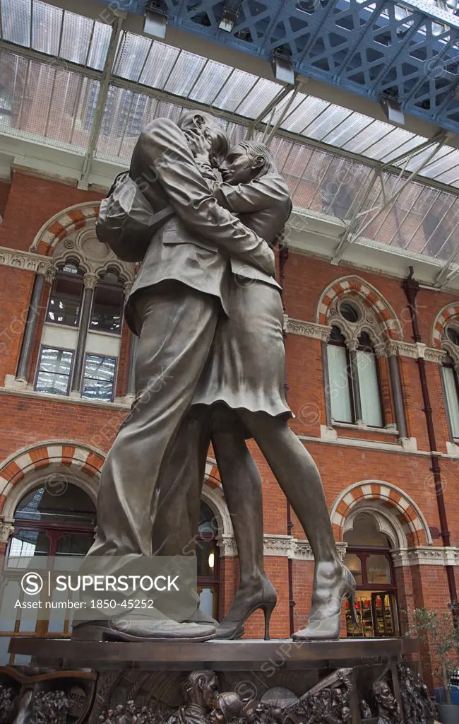 St Pancras railway station on Euston Road The Meeting Place statue by Paul Day.England London
