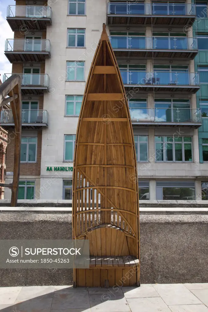 Vauxhall Albert embankment benches made from wood in the shape of boats, England London