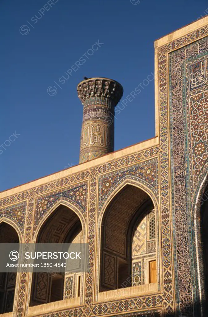 Uzbekistan , Samarkand, Registan, Tillya-Kari Madrassah Mosque Exterior Detail Of Ornate Wall Archways And Tower