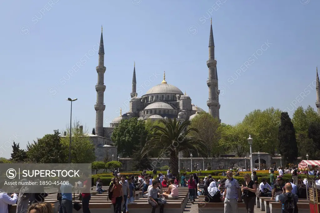 Sultanahmet Camii Blue Mosque with tourists sat outside.Turkey Istanbul