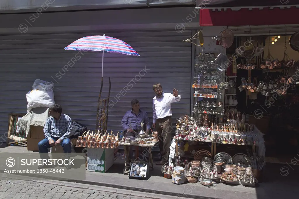 Eminonu Misir Carsisi Spice Market metal goods vendors at the entrance.Turkey Istanbul