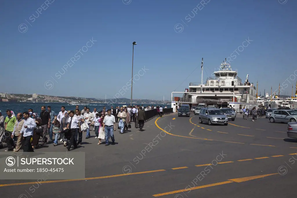 Sirkeci ferry terminal with cars and passengers disembarking.Turkey Istanbul