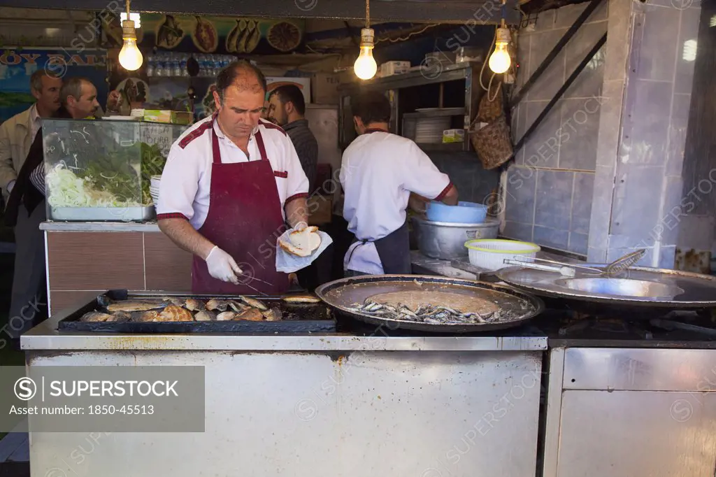 Karakoy Galata fish market stall selling fried fish snacks.Turkey Istanbul