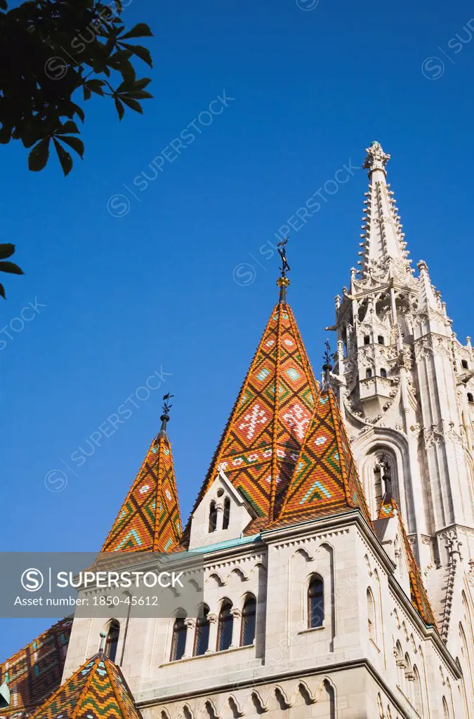 Hungary, Budapest, Buda Castle District, the tiled Bela tower with Matyas Church behind.