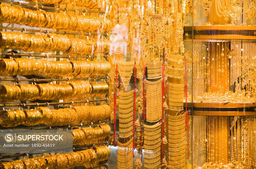 UAE , Dubai, Gold bangles and jewellery in window display of Gold Souk Deira.