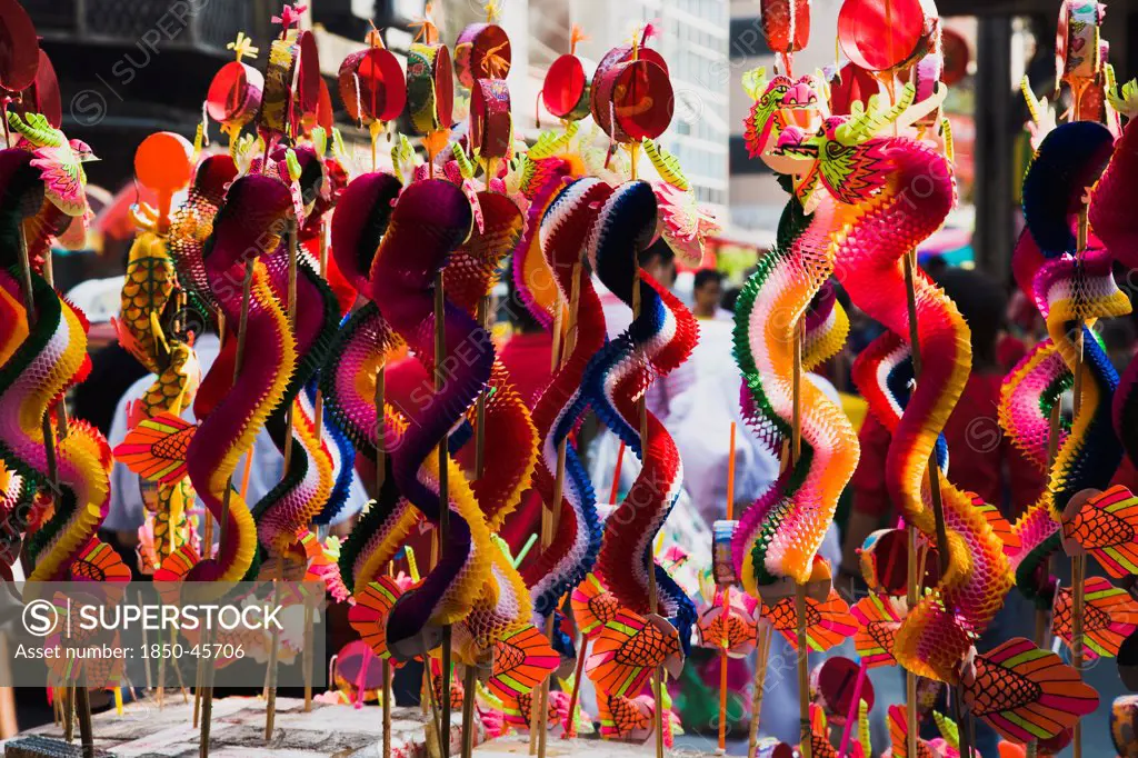 Thailand, Bangkok, Children's toy dragons on stall in Chinatown for Chinese New Year.