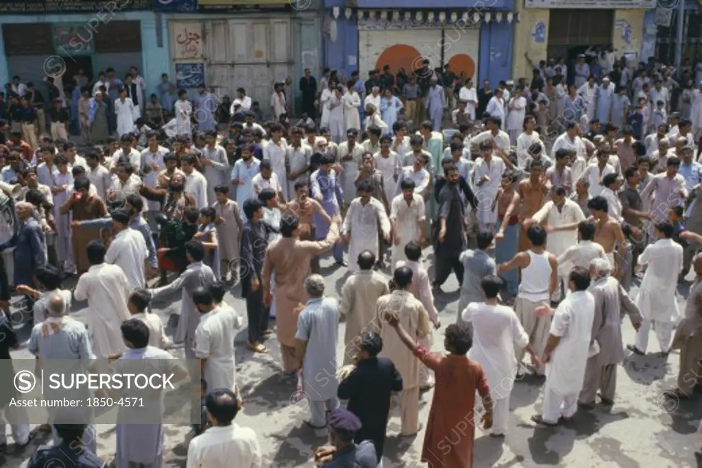 Pakistan, N W Frontier Province, Peshawar , 'Mohurrum Festival.  Men Beating Their Chests Durring Shia Muslim Festival Of Mourning To Commemorate The Death Of Husayn Ibn Ali, Grandson Of Muhammad.'