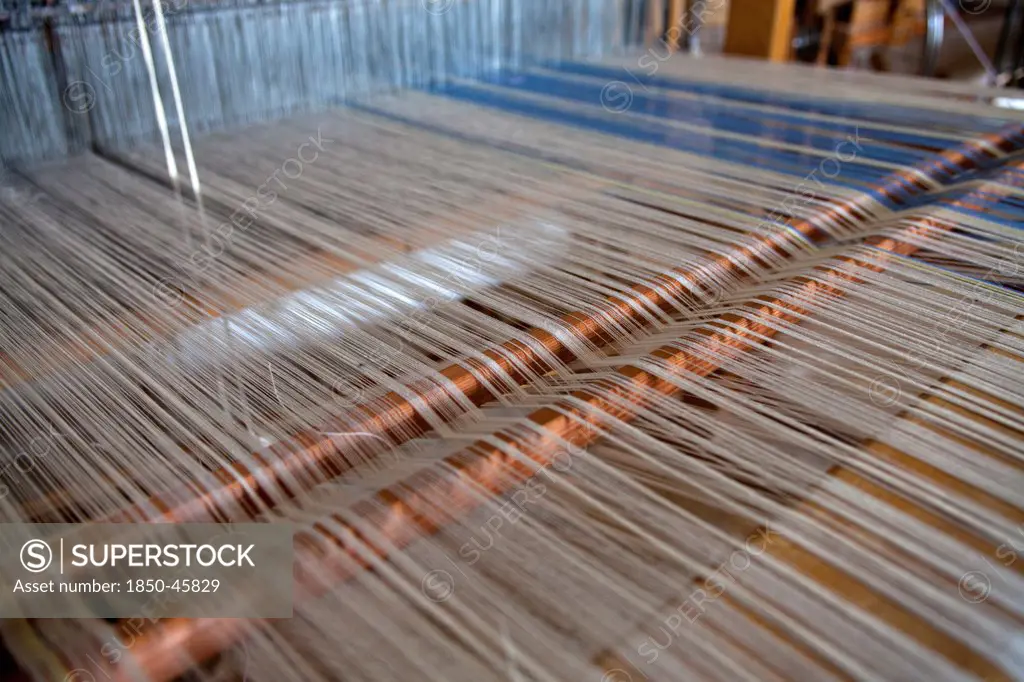 Greece, Ioannina, Zagorohoria, Close of an old traditional loom with cotton lined threads.