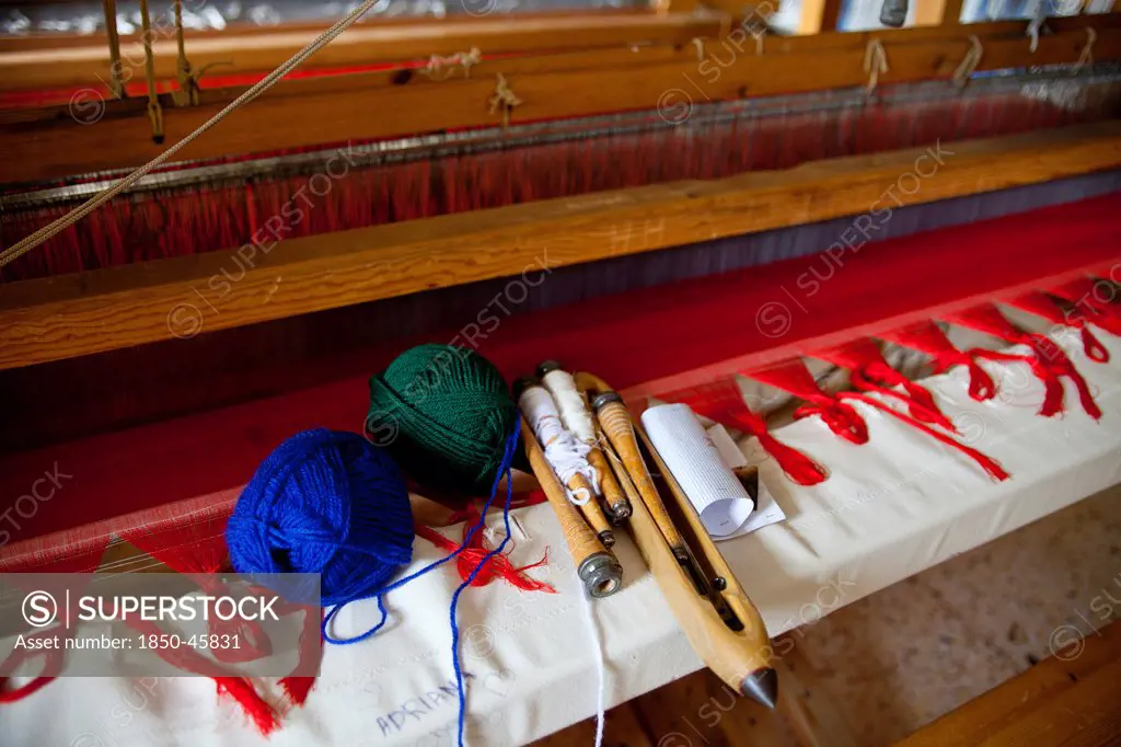 Greece, Ioannina, Zagorohoria, Close of an old traditional loom with balls of wool and tools.